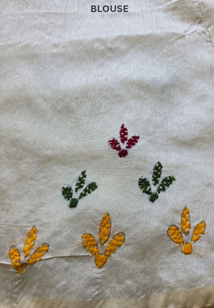 Close-up of mustard yellow and green hand embroidered motifs on Gulbahar Chanderi saree