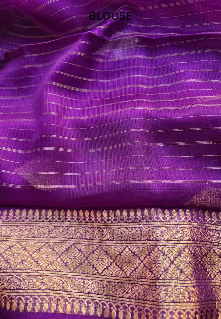 Woven gold zari border detail on royal purple Kota silk brocade saree
