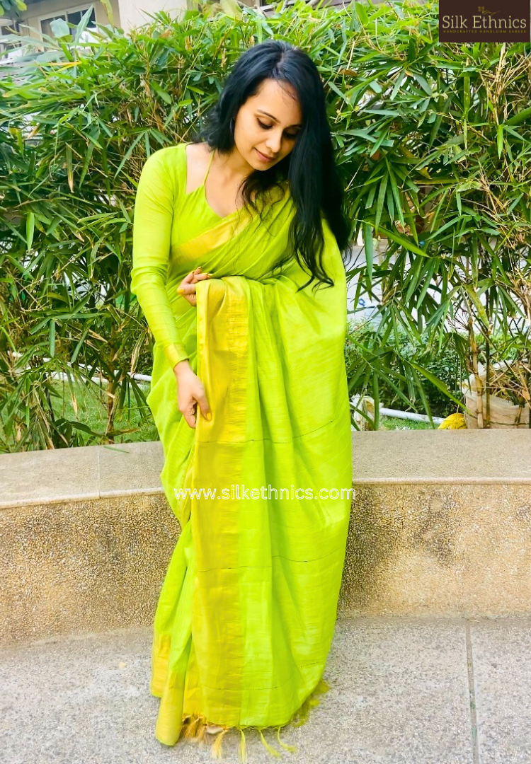 Temple border green raw silk saree