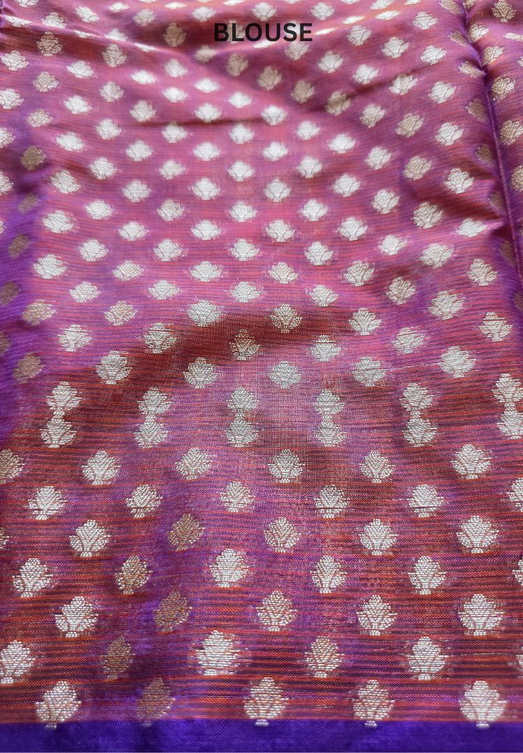 Purple fabric with woven zari butis, detail of the Orange Pichwai Kota silk saree