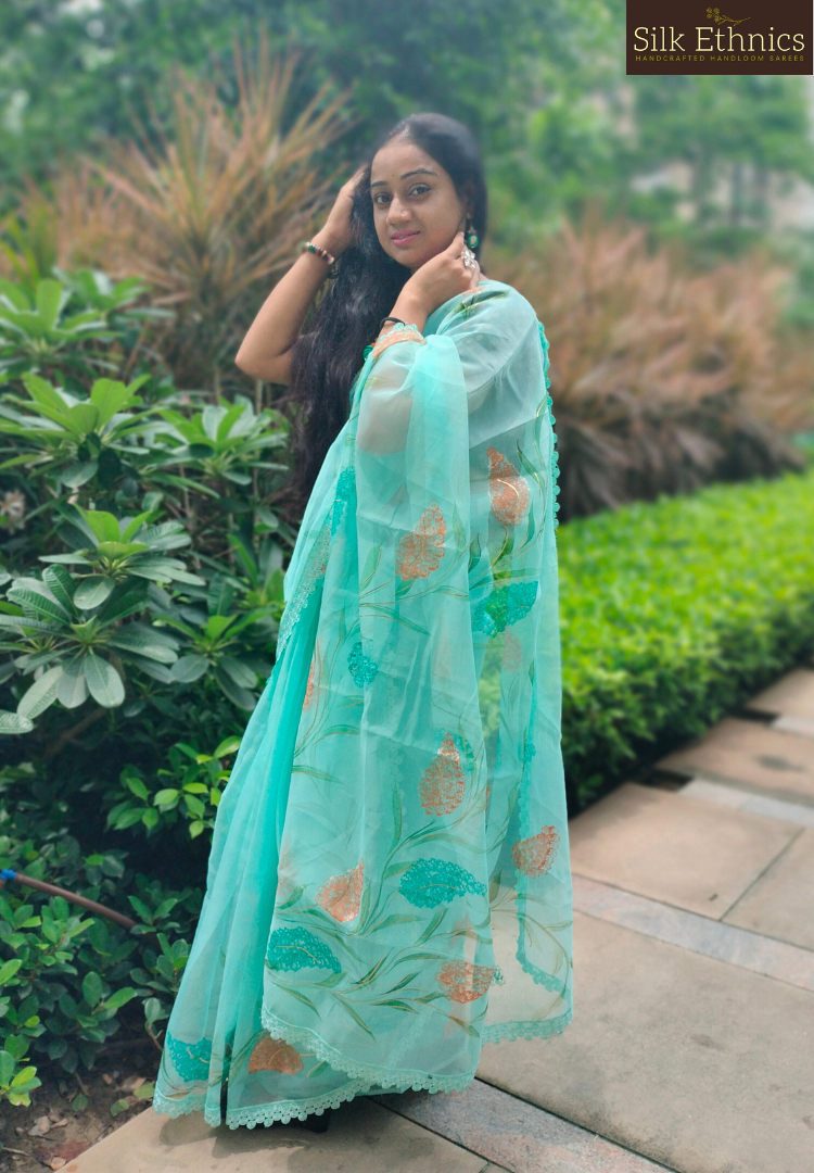Handpainted turquoise Blue soft organza saree