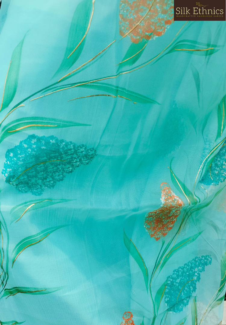 Handpainted turquoise Blue soft organza saree