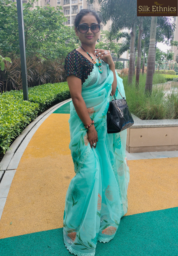 Handpainted turquoise Blue soft organza saree