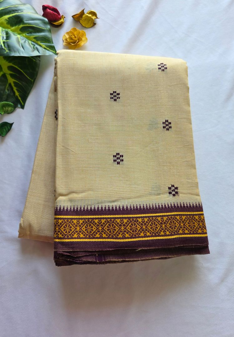 Folded almond beige Dhaniakhali handloom cotton saree with brown woven border