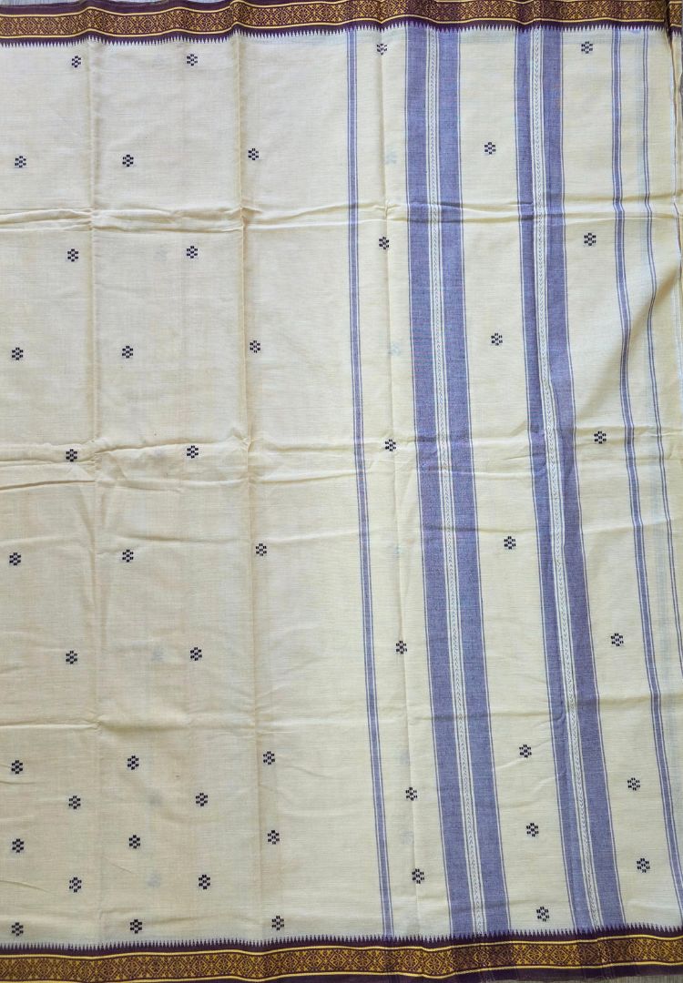 Small woven buttis on the almond beige body of a Dhaniakhali handloom saree