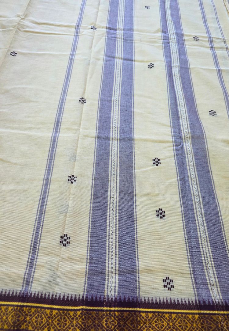 Striped pallu detail of an almond beige Ikkat Dhaniakhali cotton saree