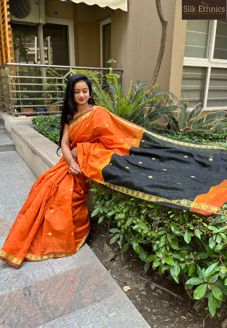 Vibrant orange Maheswari silkcotton saree