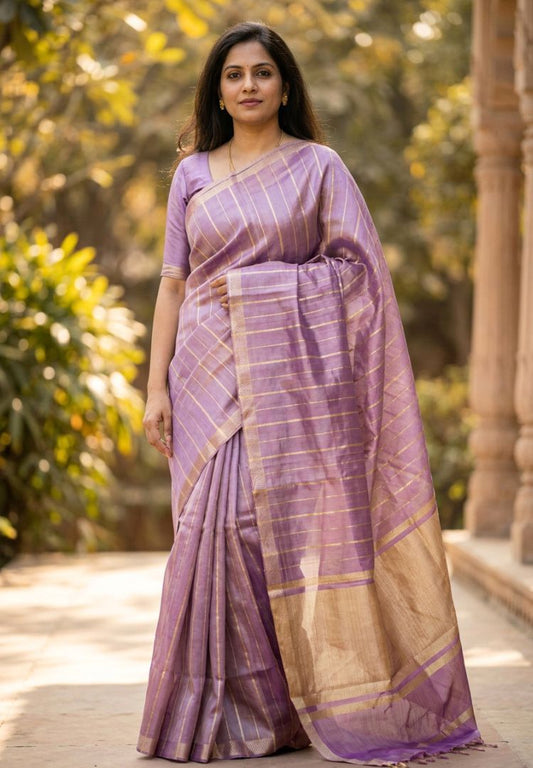 Woman wearing a lavender gold zari striped katan tissue saree - Silk Ethnics
