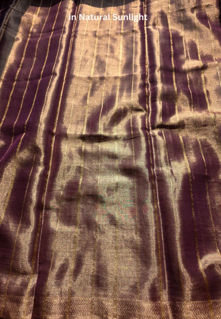 Rich gold zari pallu of a lavender gold katan tissue saree
