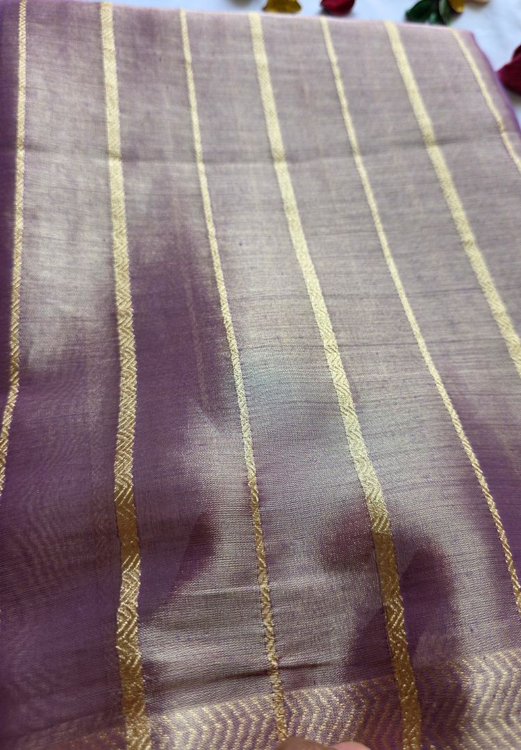 Fine gold zari stripes on a lavender katan tissue saree