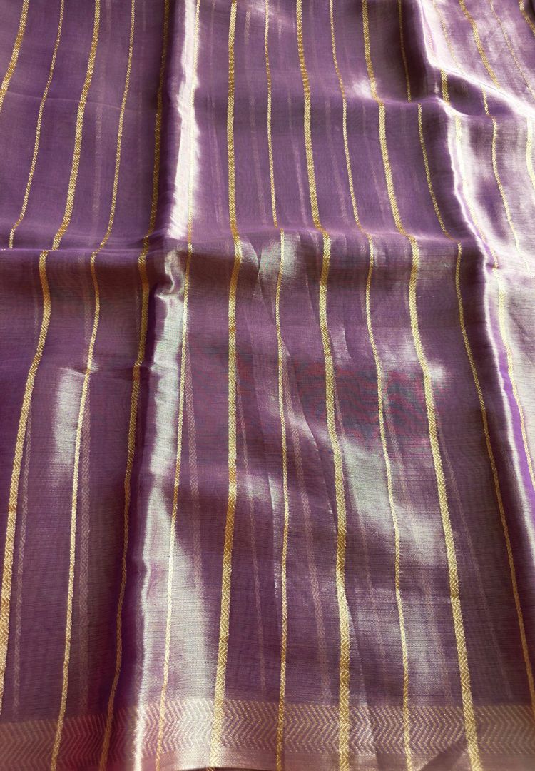 Soft flowy drape of a lavender gold tissue saree
