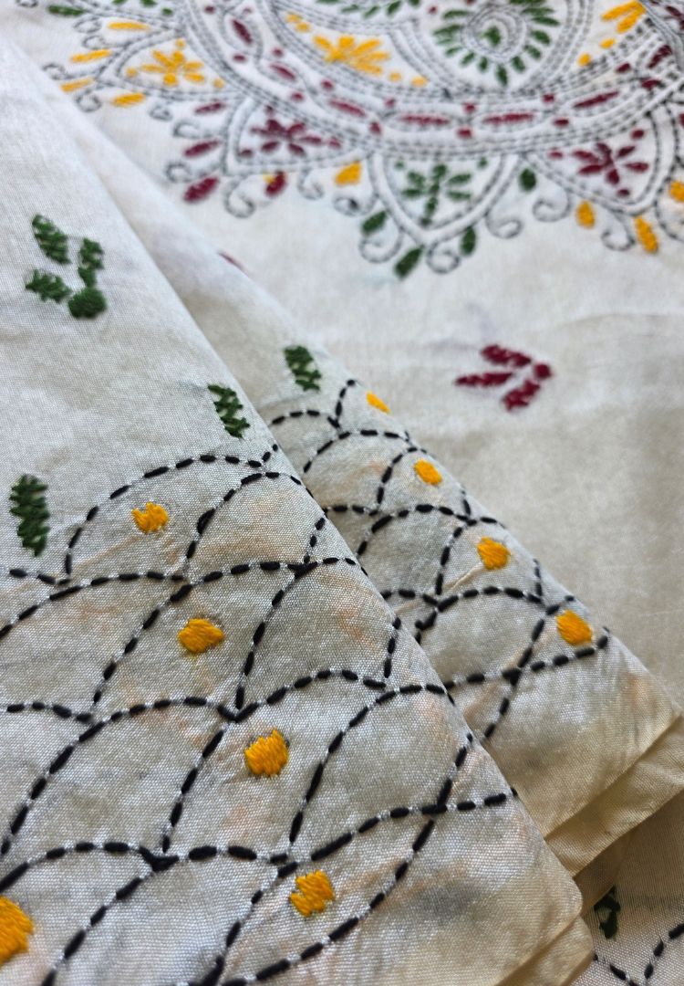 Scalloped kantha border with phulkari floral motifs on ivory Chanderi saree
