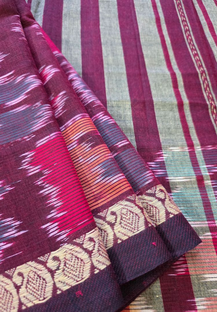 Close-up of maroon Ikkat weaving on the pallu of a pink Dhaniakhali cotton saree