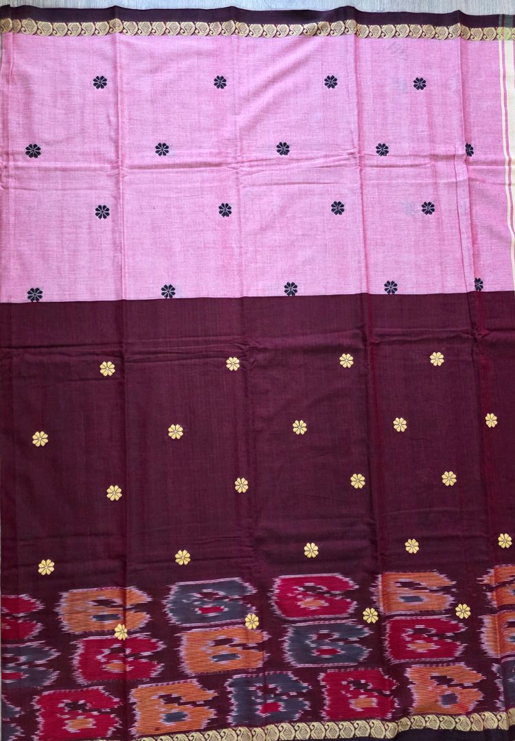 Border and weave detail of a pink and maroon Ikkat Dhaniakhali saree