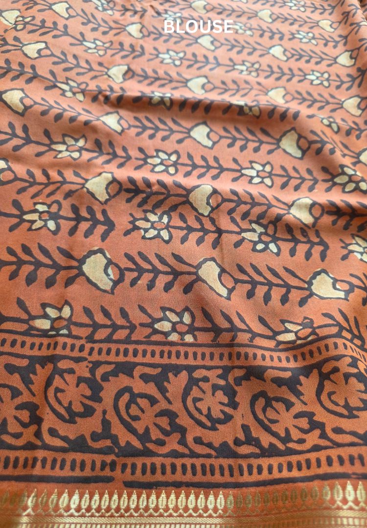 Rust Orange Ajrakh hand blockprinted Maheswari silk saree