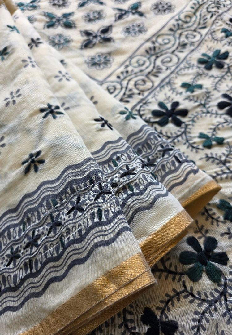 Close-up of black hand embroidery and border on ivory Chanderi silk-cotton saree