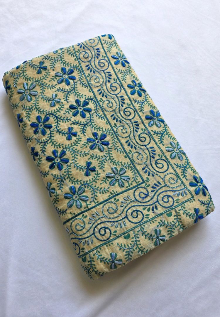 Folded Ivory and Teal Blue Gulbahar hand embroidered Chanderi silk-cotton saree