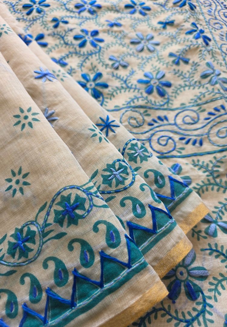 Teal blue hand-embroidered motifs on an ivory Gulbahar Chanderi saree