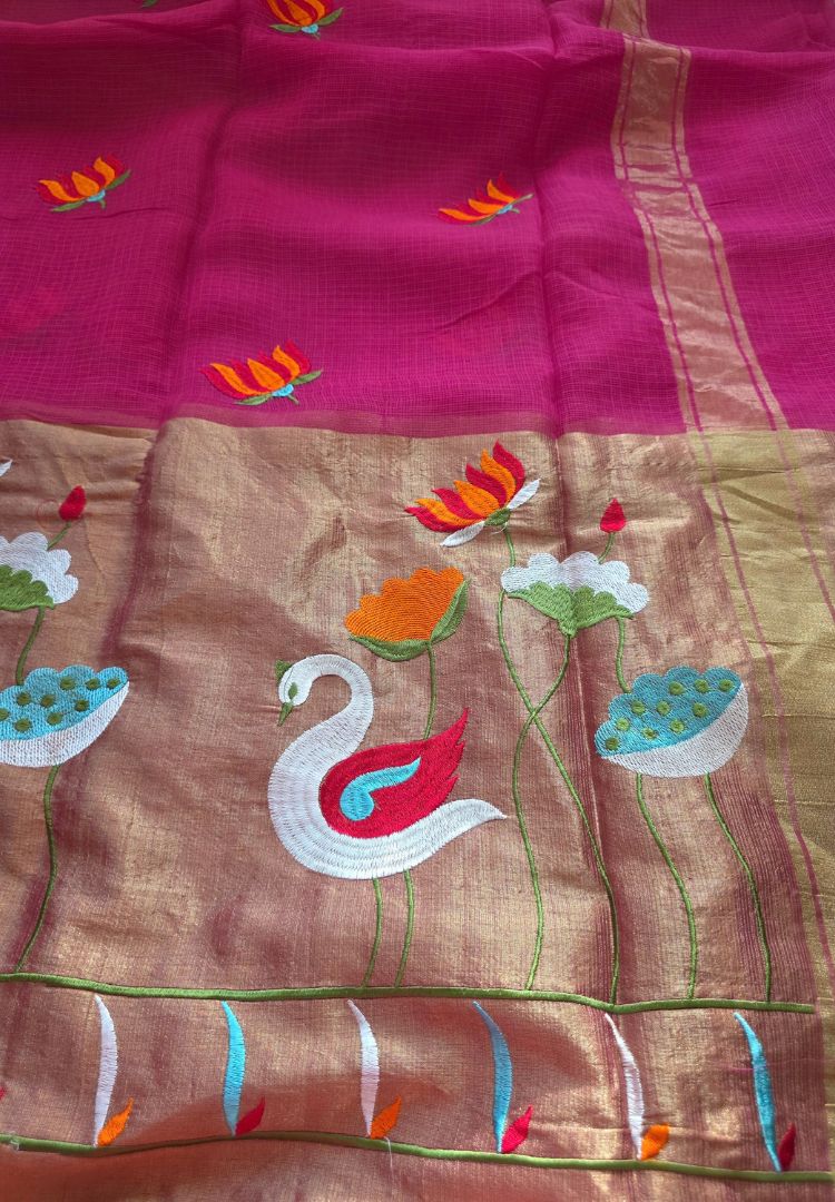 Embroidered swans and lotus on the gold zari pallu of a fuchsia pink Kota saree