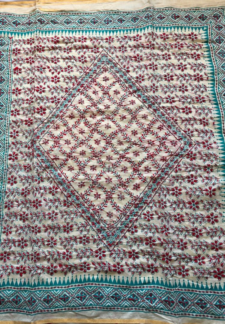 Close-up of red hand-embroidered motifs on ivory Gulbahar Chanderi silk-cotton