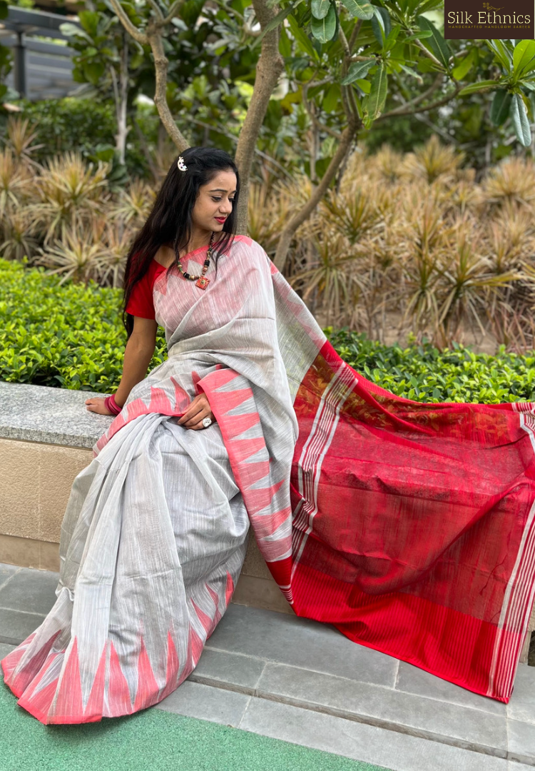 Silver grey and vibrant red temple border saree