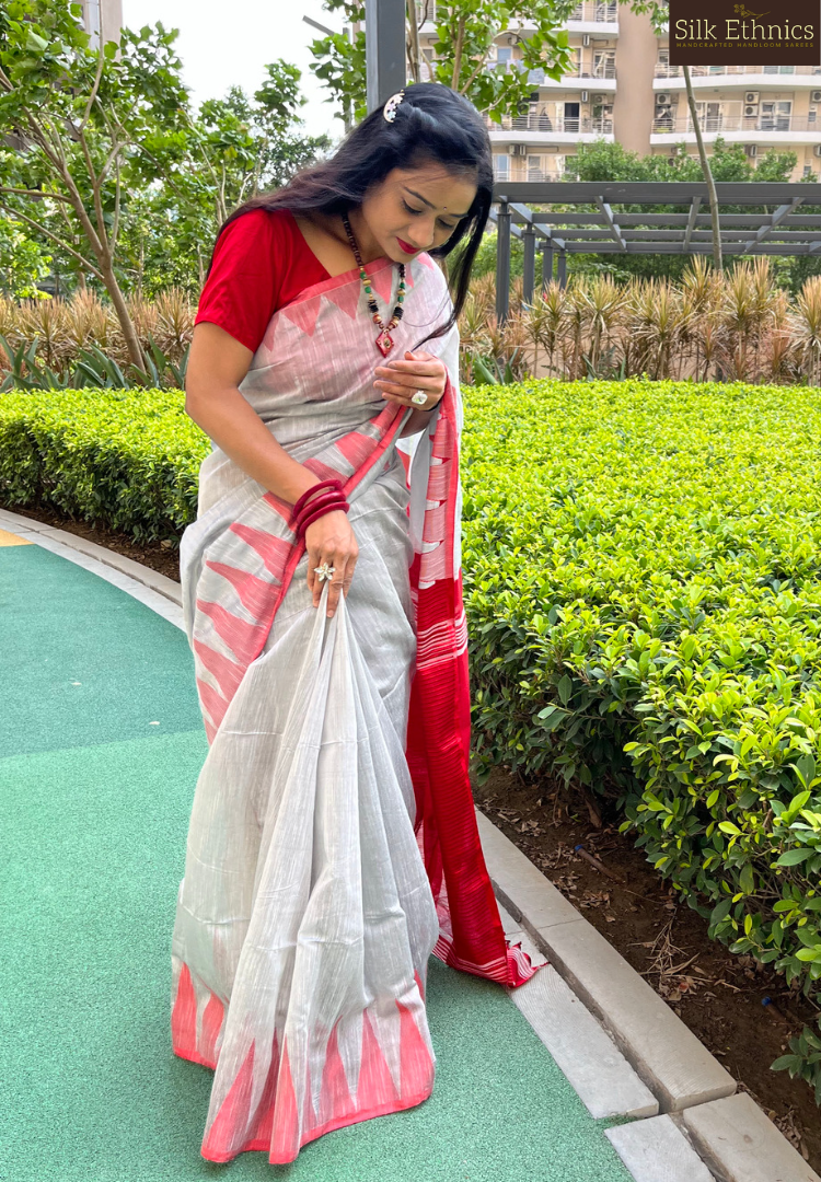 Silver grey and vibrant red temple border saree