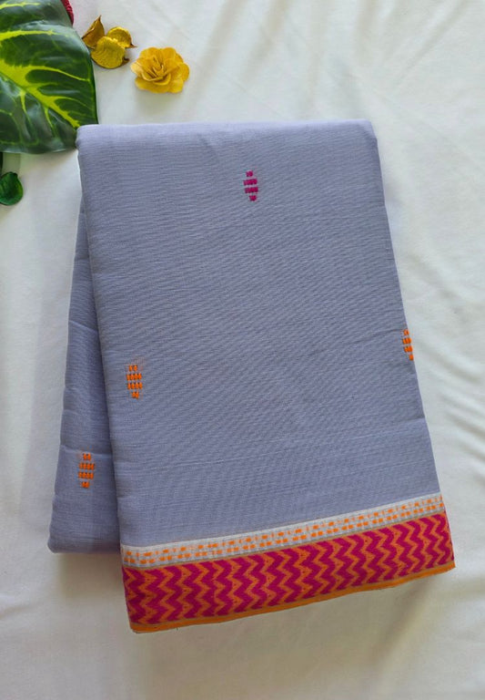 Folded lavender Dhaniakhali handloom cotton saree with red buttis and red Ikkat border