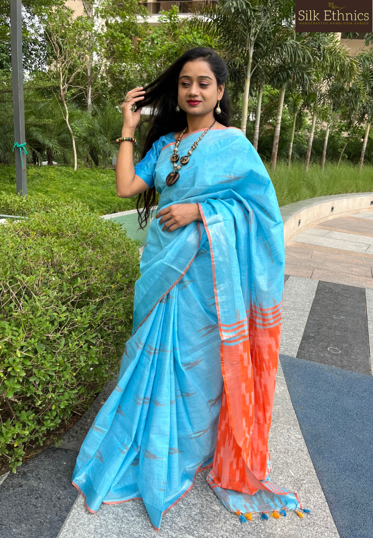 Sky blue and orange linen ikkat weaving saree