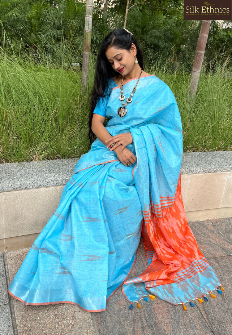 Sky blue and orange linen ikkat weaving saree