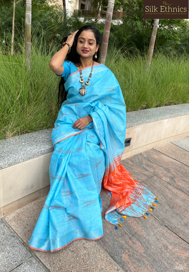 Sky blue and orange linen ikkat weaving saree