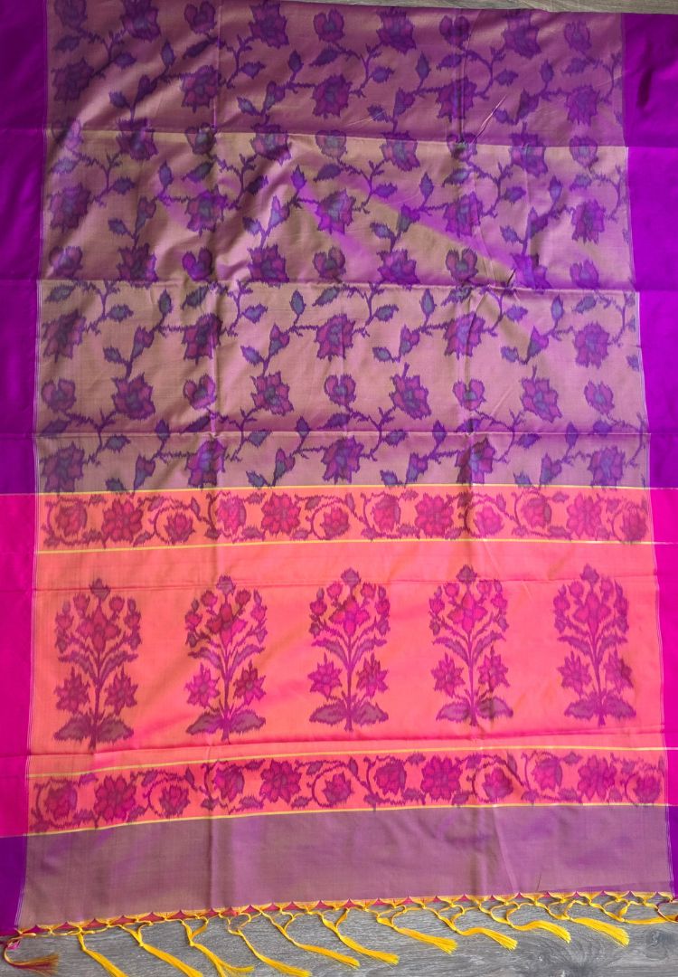 Purple Ikkat jaal and rani pink pallu border on a magenta and gold semi katan silk saree