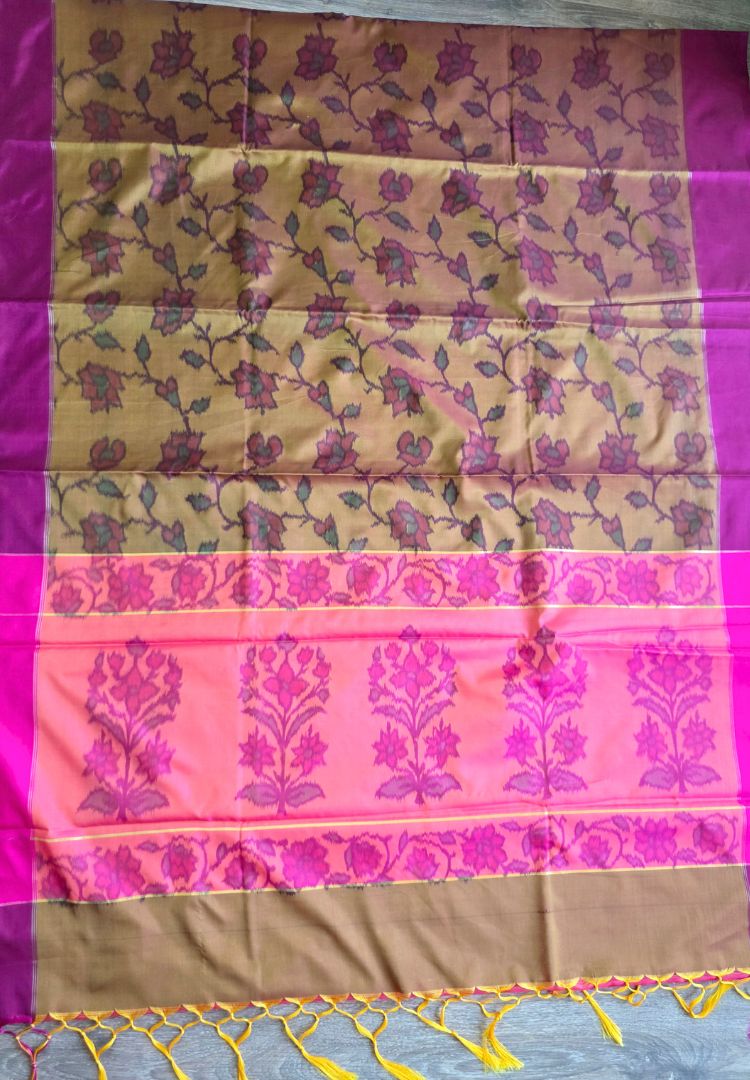 Ikkat motifs on the pink pallu of a mustard gold semi katan silk handloom saree