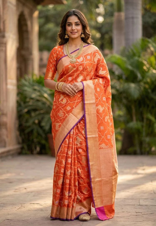 Woman wearing the Vibrant Orange Pichwai zari weaving Kota silk saree - Silk Ethnics