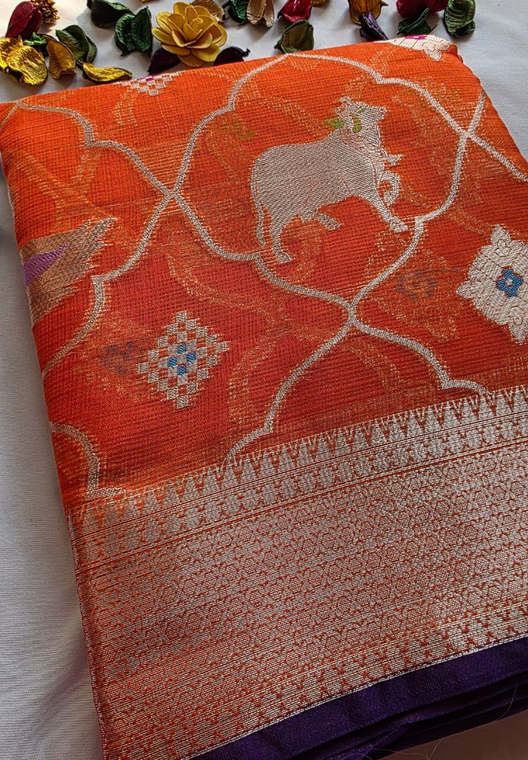 Orange Pichwai Kota silk saree body with woven zari cows and border