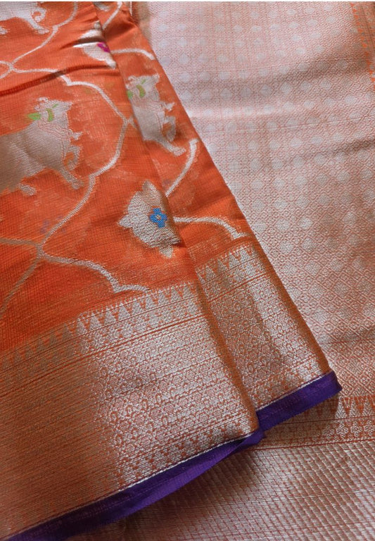Zari woven Pichwai cow motifs and border on the orange Kota silk saree