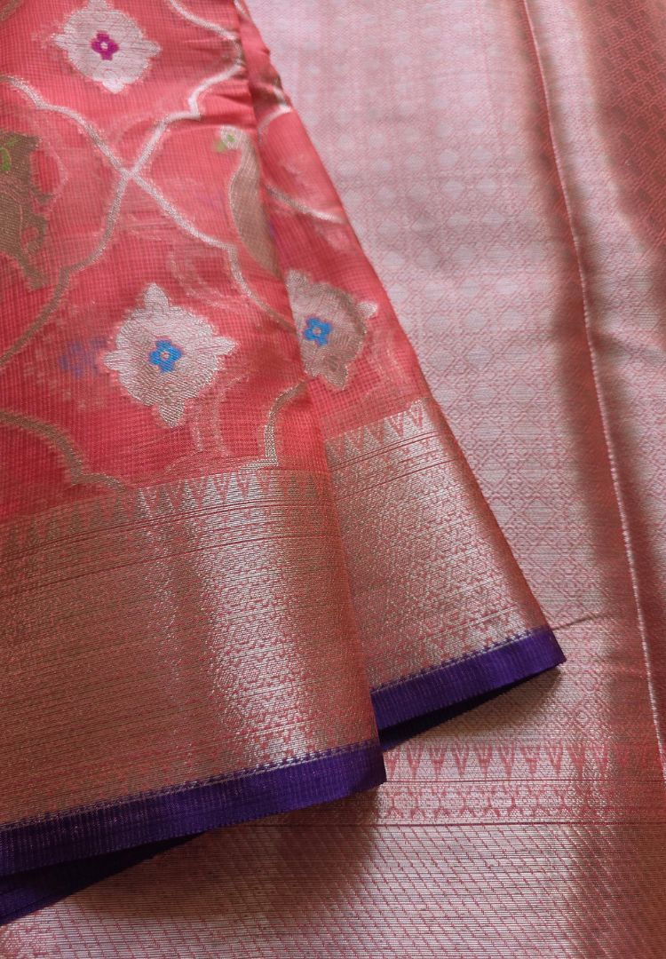 Pichwai cow motifs woven in zari on rose pink Kota silk with purple-edged border