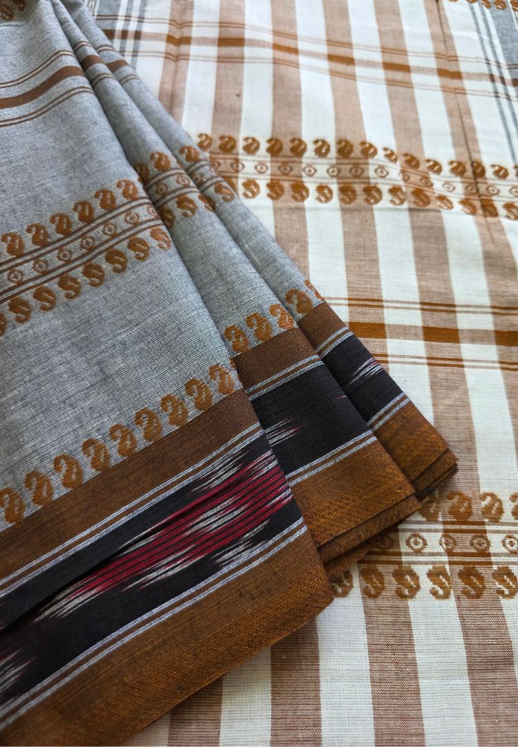 Ikkat band detail on a steel grey Dhaniakhali handloom cotton saree