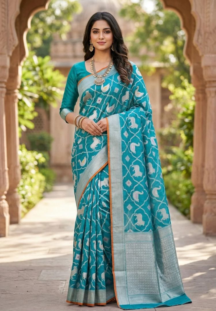 Woman wearing the Teal Blue Pichwai zari weaving Kota silk saree - Silk Ethnics
