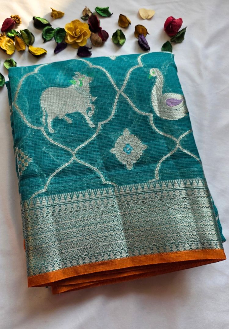Zari woven Pichwai cow motif in a trellis on teal blue Kota silk