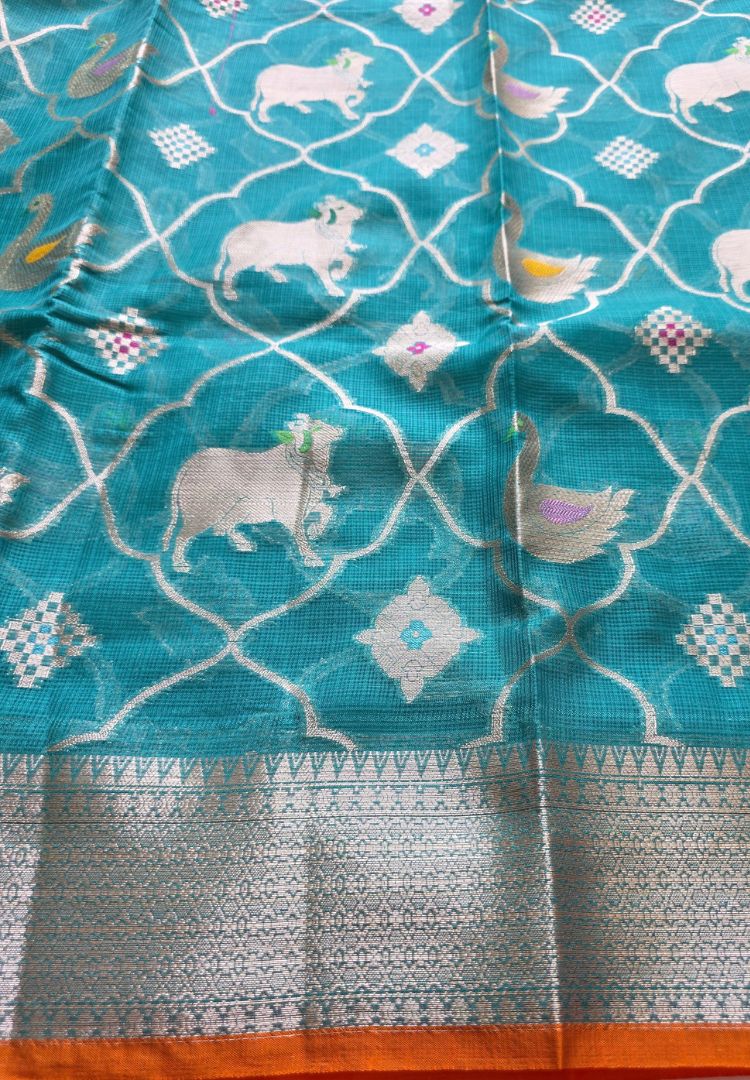 Pichwai cows woven in zari with zari border on teal blue Kota silk saree