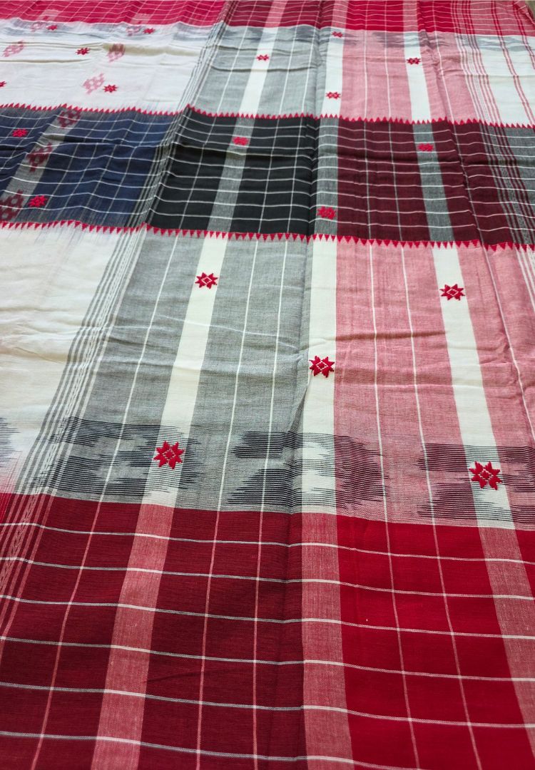 Pallu detail of a red and white Ikkat Dhaniakhali cotton saree